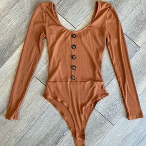 Long sleeve body suit with button detail